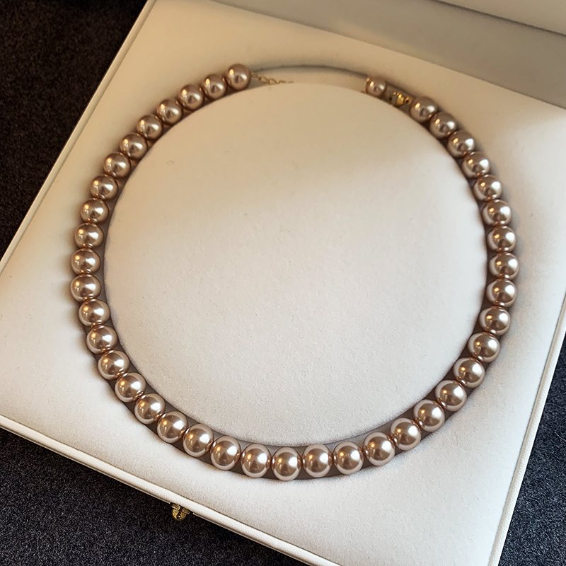 Champagne colored pearl necklace for women, light luxury, high-end feeling, collarbone chain, 2024 new popular necklace, niche neck accessory